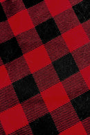 Close-up of red and black buffalo plaid fabric with a checkered pattern.