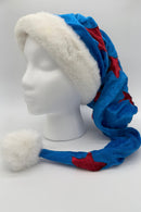 Blue Velvet Santa-style hat with red star accents, white faux fur trim, and a fluffy white pom-pom, displayed on a white mannequin head.