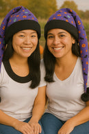 Two people wearing colorful beanies with a blurred natural background