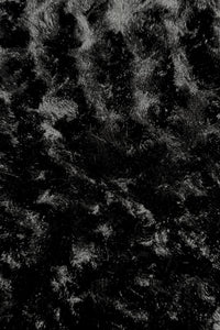 Close-up view of a black panne Velvet fabric.  The panne Velvet is soft, shiny, and has slightly wavy pattern reflecting light.